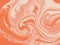 Colorful liquid marbling paint texture background abstract with a color mix of orange and white