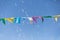 Colorful little Flags Moved by the Wind: Sky in the background and Soap Bubbles in the Air