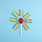 Colorful lollipop and jelly like a sun and sunshine on bright blue background. Flat lay. Minimal summer concept.