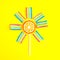 Colorful lollipop and jelly like a sun and sunshine on bright yellow background. Flat lay. Minimal summer concept.