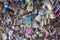 Colorful Love locks collection with messages closeup hanging on the Pont des Arts in Paris