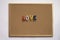 Colorful Love text written with thumbtacks on cork board for Valentine`s Day