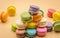 Colorful Macaron sweet and delicious on cream color background