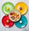 Colorful macarons on bright plate