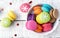 Colorful macarons with christmas decoration on white wooden table