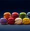Colorful macarons delicately arranged in a vibrant spectrum