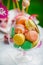 Colorful macarons in a glass isolated