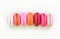 Colorful macarons on white background