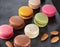 Colorful macaroons on the black slate