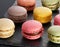 Colorful macaroons on the black slate