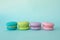 Colorful macaroons on a blue textural background