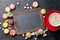 Colorful macaroons, coffee and blackboard