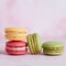 colorful macaroons on pastel background