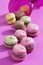 Colorful macaroons, pink background