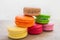 Colorful macaroons stacked on wooden table