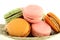 Colorful macaroons on white wood table