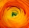 Colorful macro of the heart of an orange yellow buttercup blossom