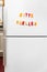 Colorful magnet letters with german text, please fill the fridge