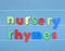 Colorful magnetic letters spelling nursery rhymes.