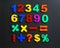 Colorful magnetic numbers and math symbols on black background