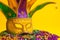 Colorful Mardi Gras or venetian mask on yellow