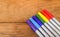 Colorful Marker Pens in Rainbow Order on Wooden Table