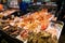 Colorful market stall with seafood in traditional Nishiki Market in Kyoto.