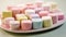 Colorful marshmallows on a white plate