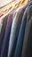 Colorful mens fashion Hanging suits in a store or showroom