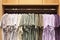 Colorful mens shirt hanging in clothing outlet display shelf