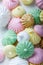 Colorful meringue cookies on napkin, natural light