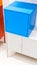 Colorful metal cabinets againt the white wall