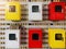 Colorful metal cabinets hanging on bamboo wood wall ,Row of metal lockers in different colors in natural light outside the