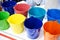 Colorful metal galvanized buckets in store