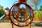 Colorful metal playground in the yard. Spiral, swing, slide - various constructions for children`s activity