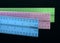 Colorful Metal Rulers on Black glass reflection