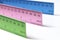 Colorful Metal Rulers on White Tabletop