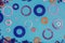 Colorful metallic rings washers on blue wooden background