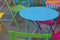 Colorful metallic table and chairs. Cafe furniture. Outdoor