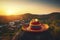 Colorful Mexican Sombrero with Picturesque Village and Landscape at Sunset