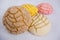 Colorful Mexican sweet bread on a white table