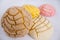 Colorful Mexican sweet bread on a white table