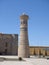 Colorful Minaret of a mosque in Uzbekistan with blue sky