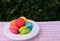 Colorful mini macarons with love mug