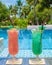 colorful mocktail at a pool bar, orange and green cocktail by the pool