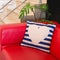 Colorful modern design pillow put on red luxury sofa. Beautiful decoration house object of relax or rest
