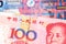 Colorful money from Hong Kong with a red Chinese yuan note