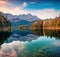 Colorful morning scene of Eibsee lake with Zugspitze mountain range on background. Amazing autumn view of Bavarian Alps, Germany,