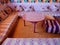 Colorful Moroccan salon with cosy seating and cushions at a Berber home. High Atlas Mountains, Morocco.