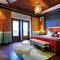 A colorful, Moroccan-themed bedroom with intricate mosaic tile patterns, draped fabrics, and lantern lighting2, Generative AI